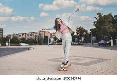 Pretty Mature Woman Having Fun With A Skateboard, Wearing Business Clothes