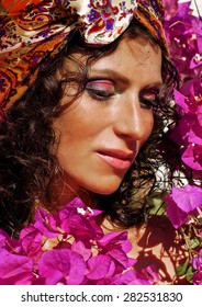 Pretty Mature Woman Outside Among Pink Flowers, Beauty Make Up In Egypt Flora Closeup