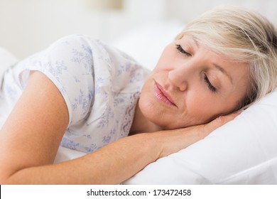 Pretty Mature Woman Sleeping With Eyes Closed In The Bed