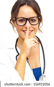 Pretty medical doctor woman commanding silence with glasses and stethoscope over white background