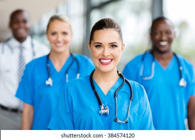 pretty medical nurse and colleagues in hospital
