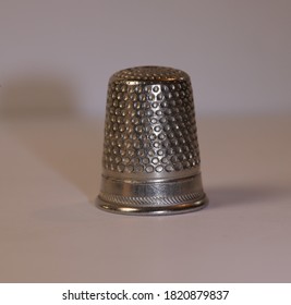 Pretty Metal Thimble With White Background