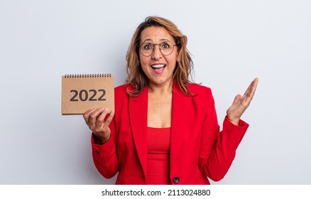 Pretty Middle Age Woman Feeling Happy And Astonished At Something Unbelievable. Calendar Concept