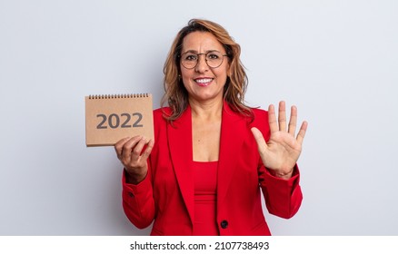 Pretty Middle Age Woman Smiling And Looking Friendly, Showing Number Five. Calendar Concept