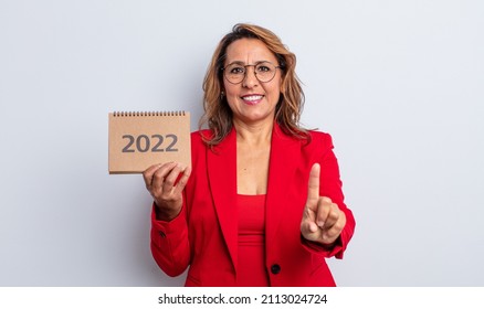 Pretty Middle Age Woman Smiling And Looking Friendly, Showing Number One. Calendar Concept