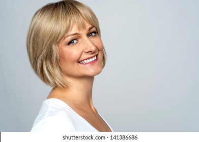 Pretty Middle Aged Lady Posing Over Grey Background