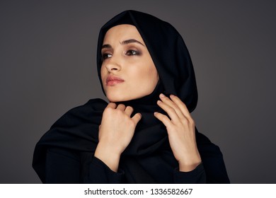 Pretty Muslim woman in black hijab Islam religion