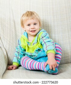 Pretty One-year Old Child On Sofa