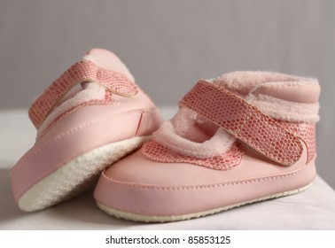 Pretty Pair Of Pink Baby Shoes With A Velcro Fastening Strap