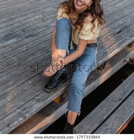 Similar – Blonde young caucasian woman smiling on steps