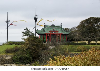 Pretty Red And Green Delicate Chinese Tea House On Marble House Grounds Seen From The Newport Cliff Walk During A Windy Fall Day, Newport, Rhode Island, USA 