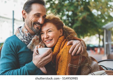 Pretty Senior Lovers Hugging With Joy