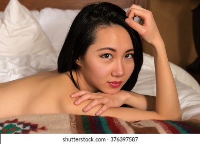 Pretty Slender Chinese Woman Nude In Bed Shutterstock