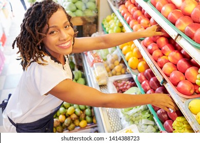 Pretty Smiling Black Woman Working At Fruit Department At Grocery Store