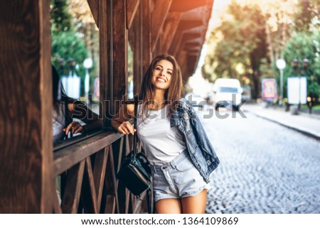 Similar – Long hair girl with hat and sunglasses walking in Sydney city streets in Australia.