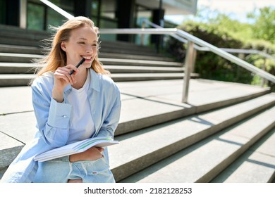 Pretty smiling girl university student holding notebooks looking away sitting on stairs inspired for writing outdoors. College study programs, academic educational courses, learning classes concept. - Shutterstock ID 2182128253
