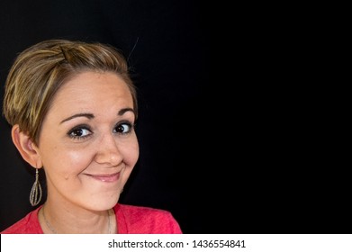 Pretty Smiling Woman With Short Hair On Black Background