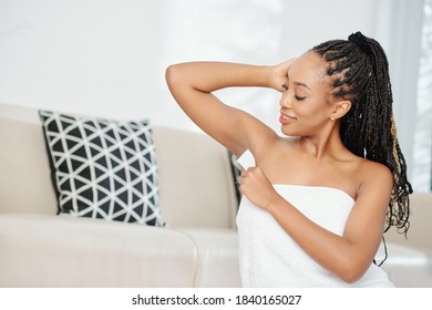 Pretty Smiling Young Black Woman U Wax Stripes To Remove Underarm Hair
