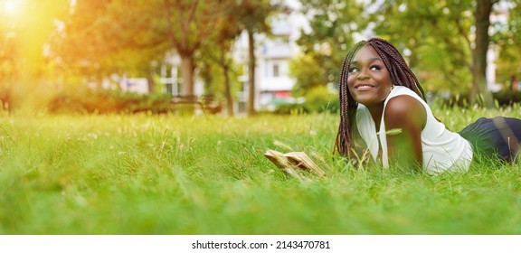 Pretty smiling young girl relaxing outdoor - Powered by Shutterstock