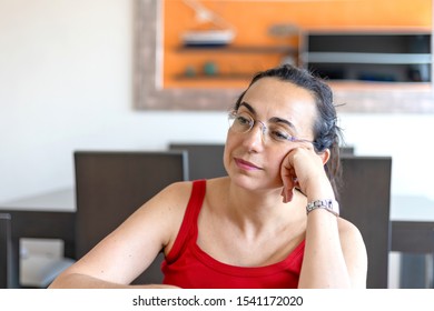 Pretty Spanish Woman Thinking Anything At Home