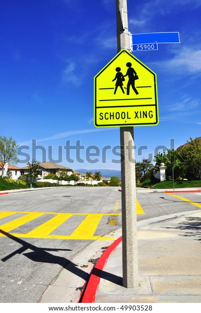 Pretty street scene of school crossing, room for\
your text