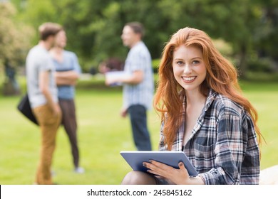 Pretty student studying outside on campus at the university - Powered by Shutterstock