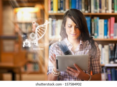 Pretty student using futuristic interface to learn about science from digital tablet standing in college library