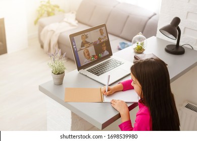 Pretty Stylish Schoolgirl Studying Homework Math During Her Online Lesson At Home, Social Distance During Quarantine, Self-isolation, Online Education Concept, Home Schooler