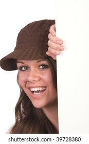 Pretty Teenage Girl Smiling And Peeking Around Door.