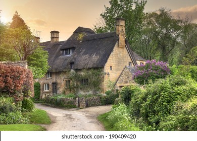 Pretty Thatched Cotswold Cottage In The Village Of Stanton, Gloucestershire, England.