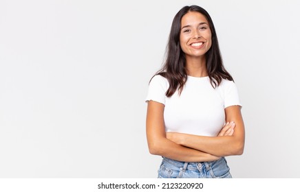 pretty thin hispanic woman looking like a happy, proud and satisfied - Shutterstock ID 2123220920