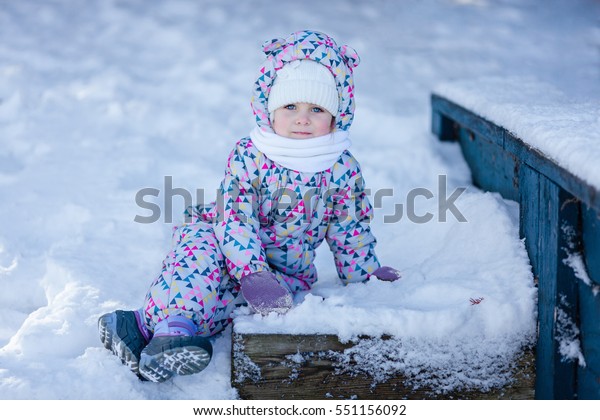 girl in snowsuit