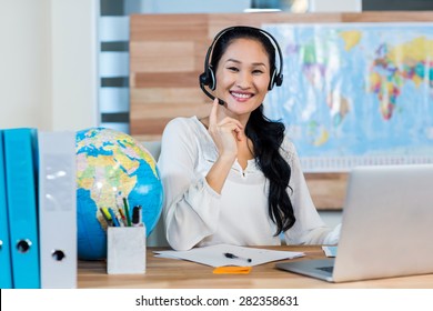 Pretty Travel Agent Smiling At Camera In The Office