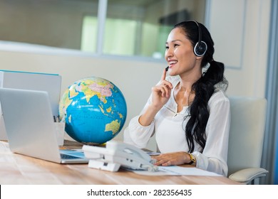 Pretty Travel Agent Speaking To Customer In The Office