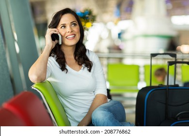 Pretty Traveller Making A Phone Call At Airport