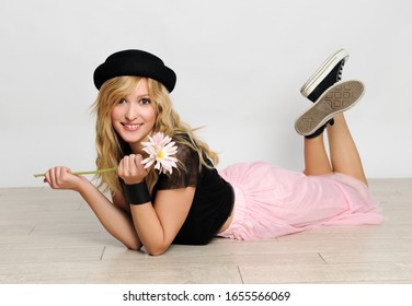 Pretty Trendy Blond Girl Posing In Black Hat And Pink Tulle Skirt