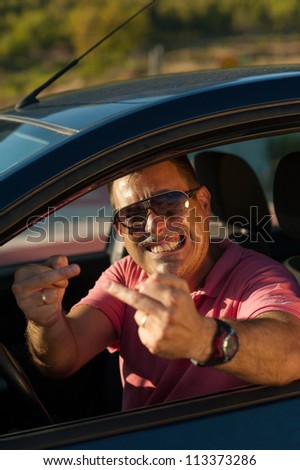 Pretty upset driver  doing obscene gestures