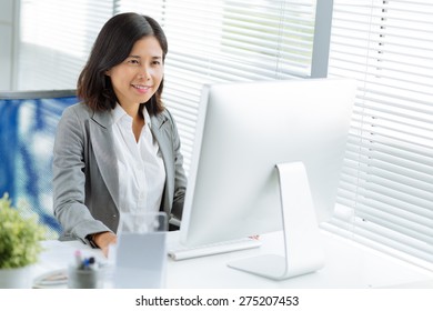 Pretty Vietnamese Business Lady Working On Computer In The Office