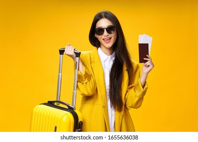 Pretty Woman Of Asian Appearance In Travel, Luggage Passport And Airplane Ticket