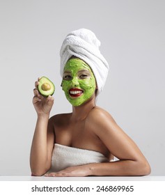 Pretty Woman With An Avocado Facial Mask