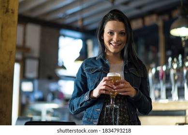 Pretty Woman In Bar Drinking Beer