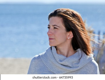 Pretty woman with confident smile portrait at the beach - Powered by Shutterstock