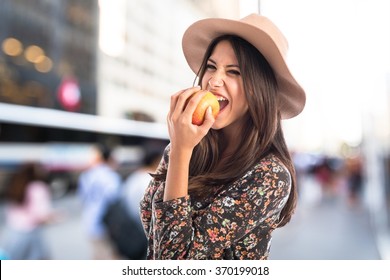 Pretty Woman Eating An Apple