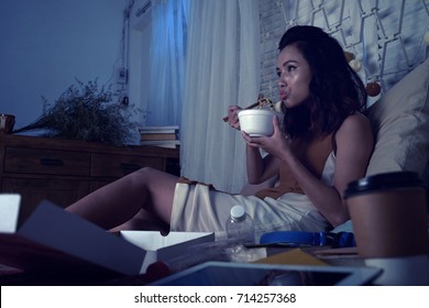 Pretty Woman Eating Ramen Soup And Watching Tv Series Late At Night