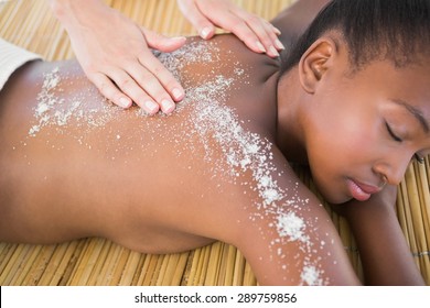 Pretty Woman Enjoying A Salt Scrub Massage At The Health Spa