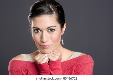 Pretty Woman Expressing Positively Hair Pulled Back Red Sweater