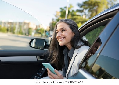 Pretty Woman Getting Out Of Car With Smarpthone Happy Smiling