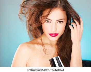 Pretty Woman With Long Hair Holding Blow Dryer