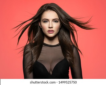 Pretty Woman With Long Straight Brown Hair Looking At Camera.  Woman With Beauty Long Brown Hair. Fashion Model With Long Straight Hair. Fashion Model Posing At Studio.
Pantone 2019.
