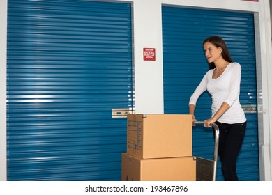 Pretty Woman Moving Cart Full Cardboard Boxes Storage Facility